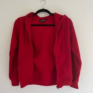 Cute red zip up sweater. Not sure where I got it. Worn once.